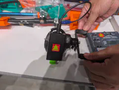 A clever fishing reel antenna by JG1GPY at the SOTA JP booth. A switch allows selecting a direct connection for a 40 meter 1/4 wave (with a trailing counterpoise) or a 49:1 end-fed configuration.