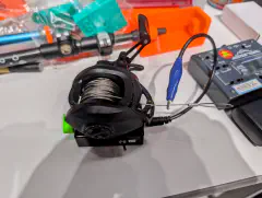 The feed point attachment is after the exit of the spool.